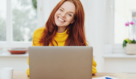 Girl smiling with a laptop