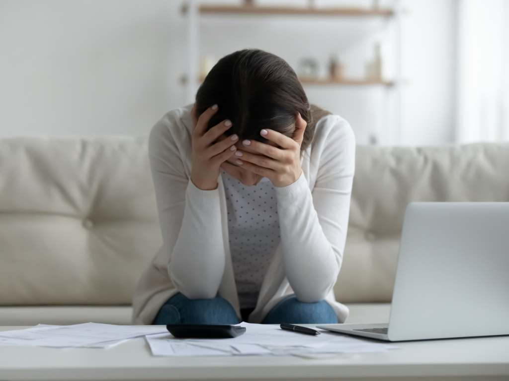 teenager feeling lost and sad in front of laptop at home