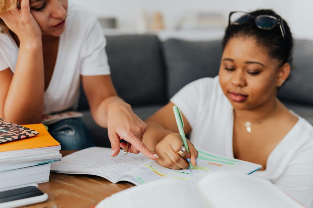 high school student and their parent studying together at home