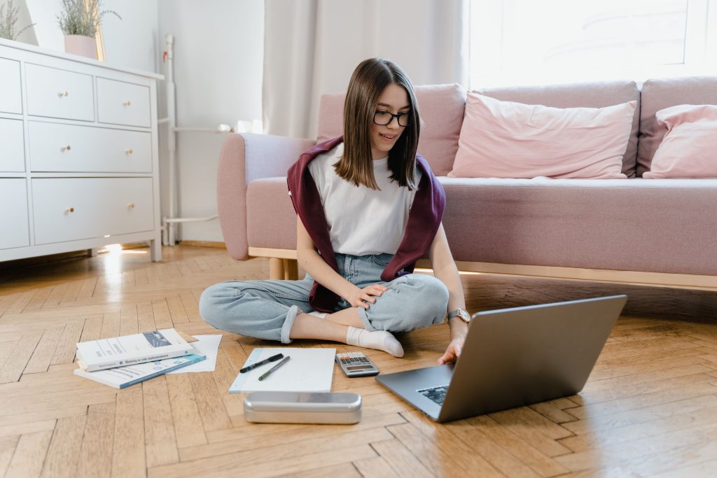 female-student-studying-on-the-floor