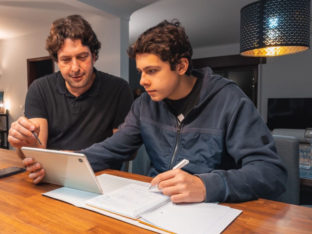 Male-tutor teaching-teenager