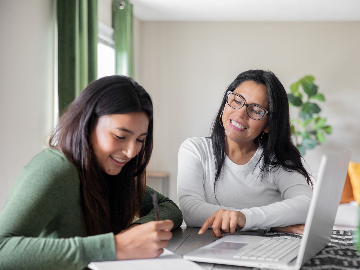 Mother-guiding-teenage-daughter-in-studying
